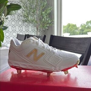 New Balance White and Gold Cleats